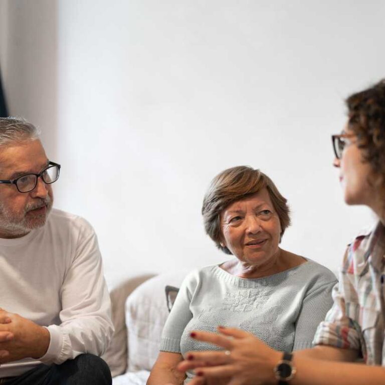 carer talking to clients about assisted living care