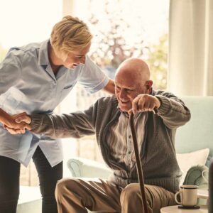 carer helping elderly man with MS Care in Solihull